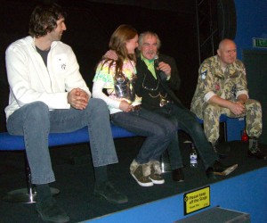 Myrea Pettit on stage with Terry English and the Predator